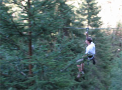 Fantasticable - Man flies above trees suspended by a cable
