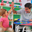 Child giving man high five