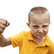 Angry boy raising fist