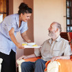 Carer bringing food