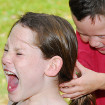 Boy pulling girls hair