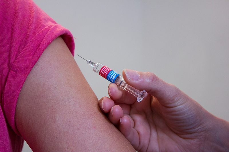 Teenager having an injection