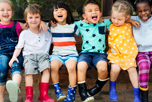 Group of young children smiling and having fun