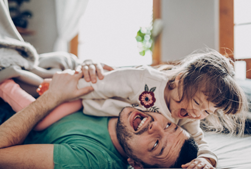 Father playing with daughter