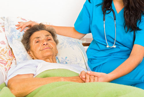 Elderly woman with her carer