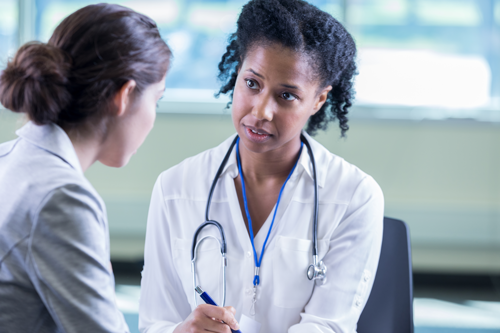 Doctor listening to a patient