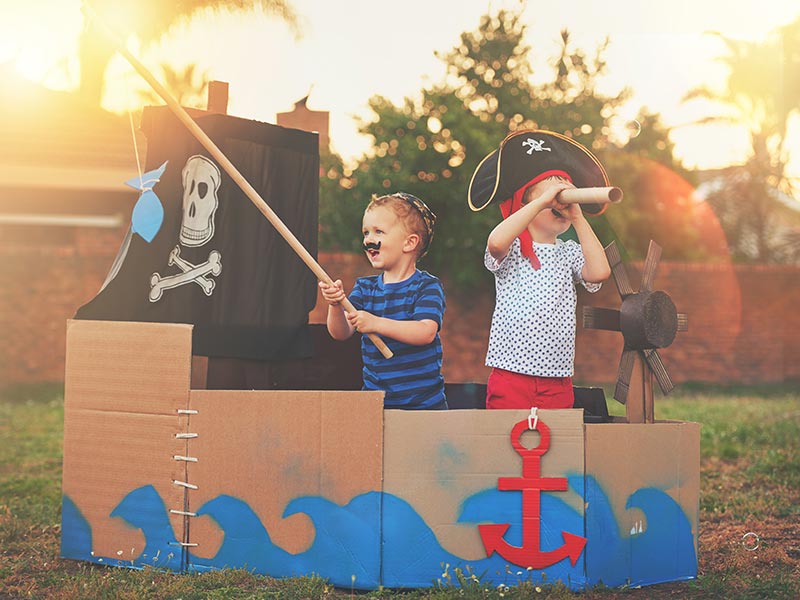 children playing dressed as pirates