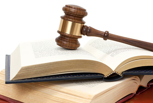 A gavel and open law books