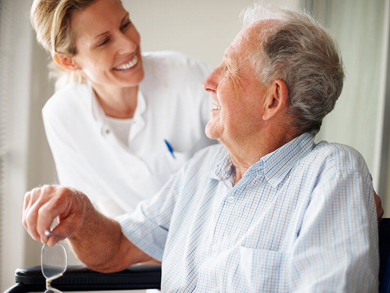 Elderly man with nurse