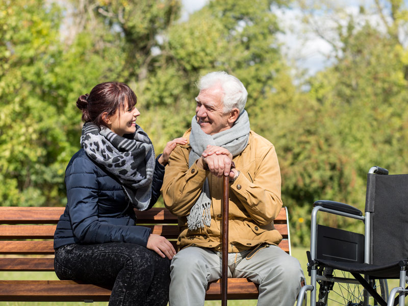 Elderly man and carer
