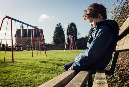 Lonely child in a playground