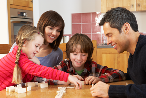 Family playing dominoes