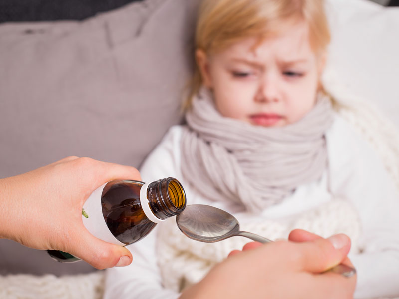 Child taking medicine