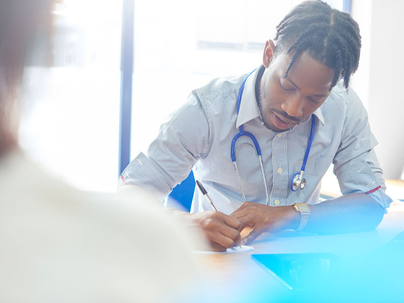 Doctor writing prescription
