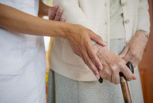 Elderly woman and care worker