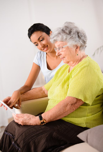Young woman helping elderly woman