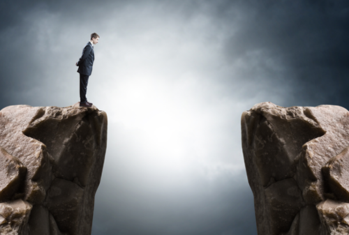 Standing on the edge of a cliff