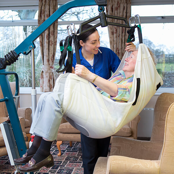 Elderly woman in a hoist