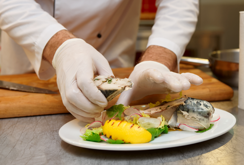 Chef serving fish