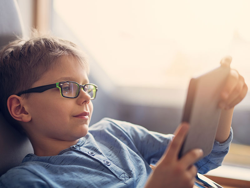 A child reading an e-book