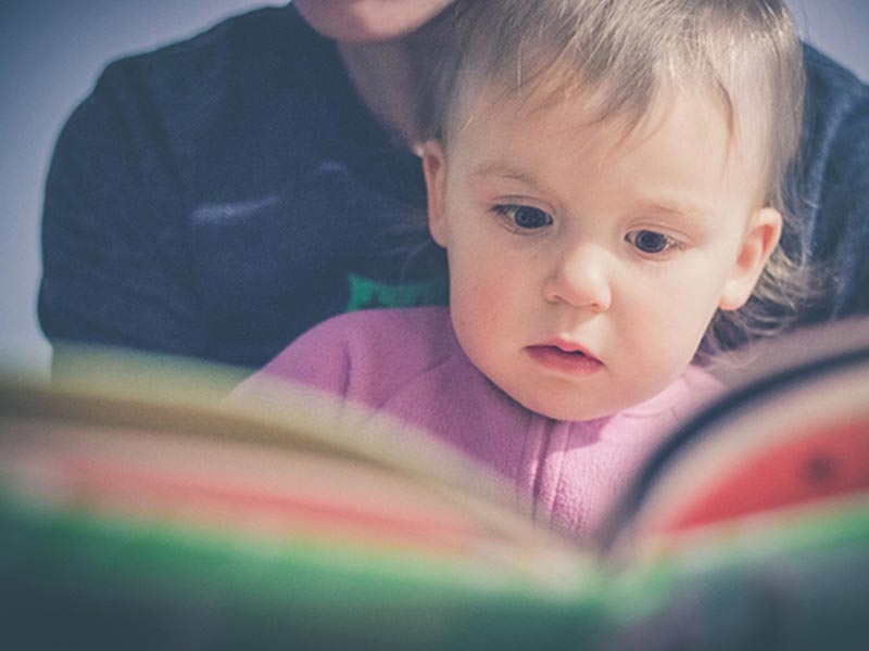 Child and parent reading