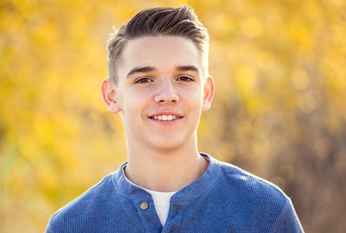 A smiling teenage boy