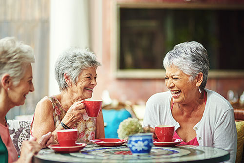 Elderly friends drinking tea