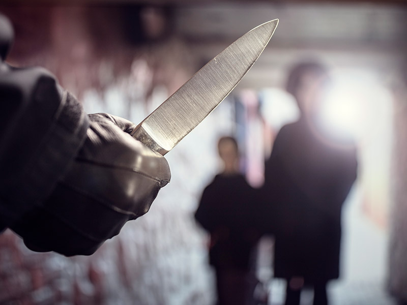 A criminal with a knife