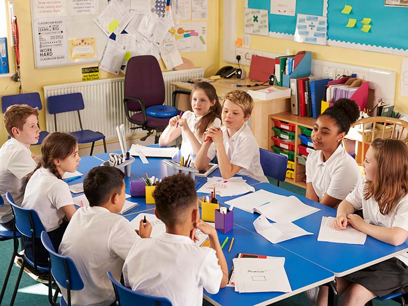Schoolchildren working on a project in class