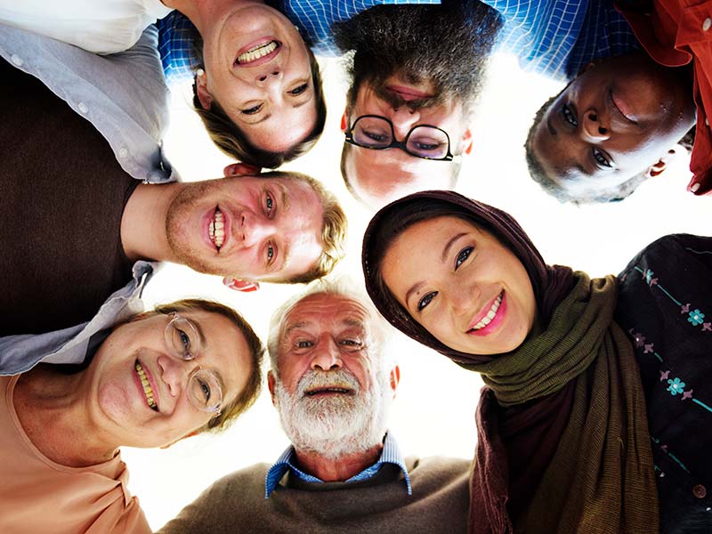 A group of multi-ethnic people of differing ages