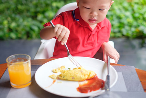 A child eating at the table