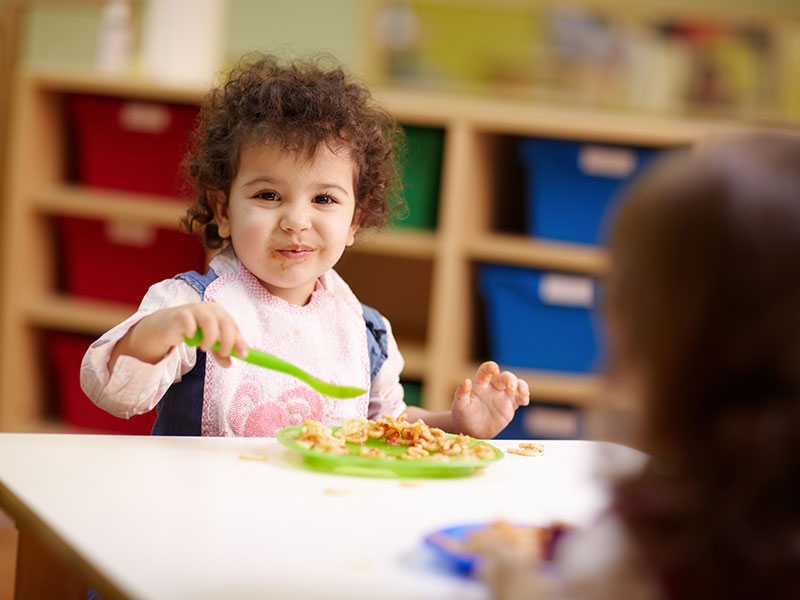 A toddler eating food