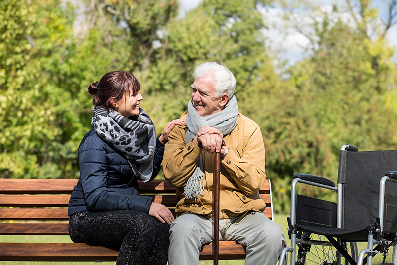 Elderly man and carer