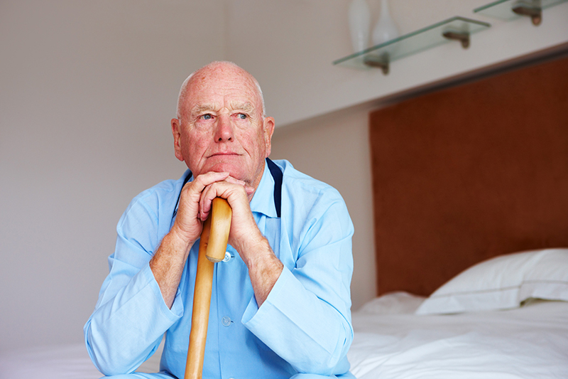 Resting hands and chin walking stick