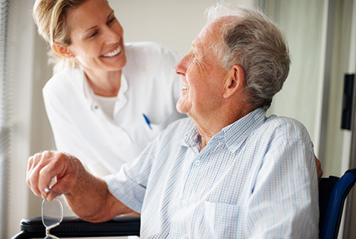 Elderly man with nurse