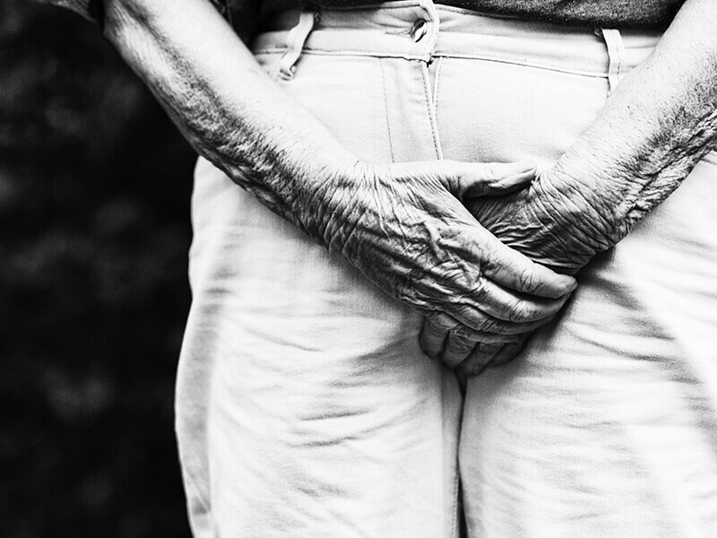 Man clutching his trousers