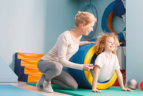 A boy in a therapeutic tunnel