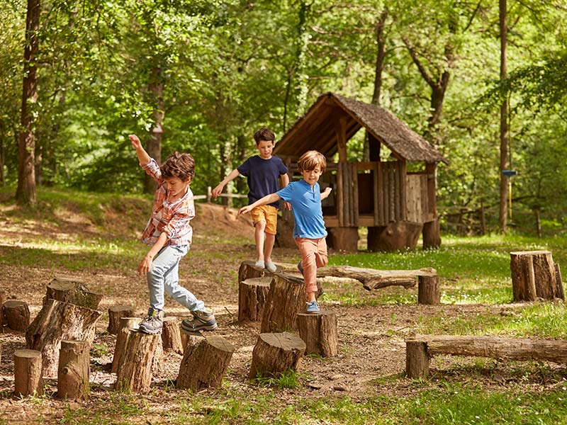 Children playing in a forest