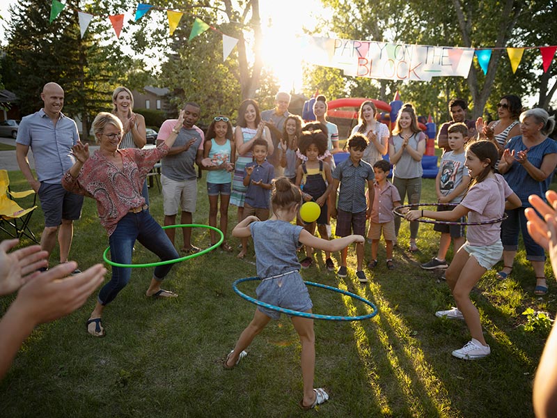 Adults and children playing at a street party