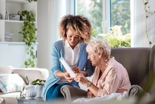 Elderly reading paperwork