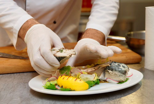 Chef serving fish