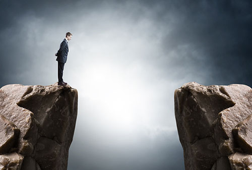 Standing on the edge of a cliff