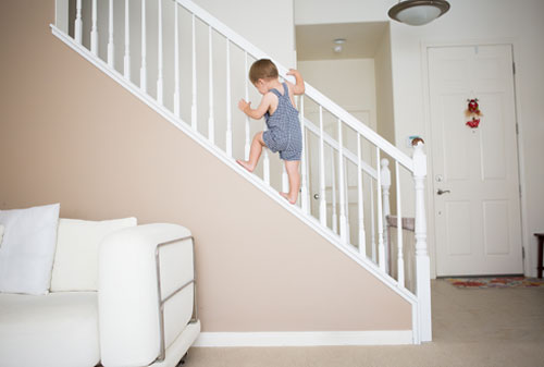 Toddler climbing stairway
