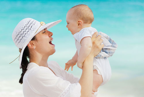 A happy mother and baby in the sun