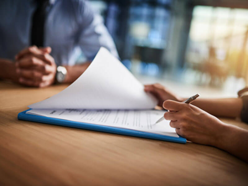 Someone completing paperwork