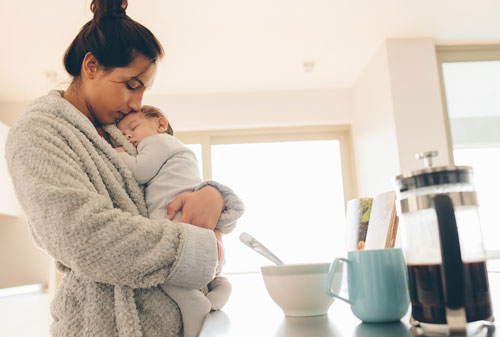 A babay sleeping in Mother's arms