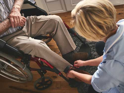 Healthcare worker with disabled man