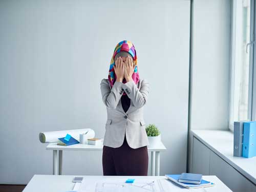 Woman covering face