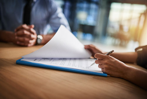 Someone completing paperwork